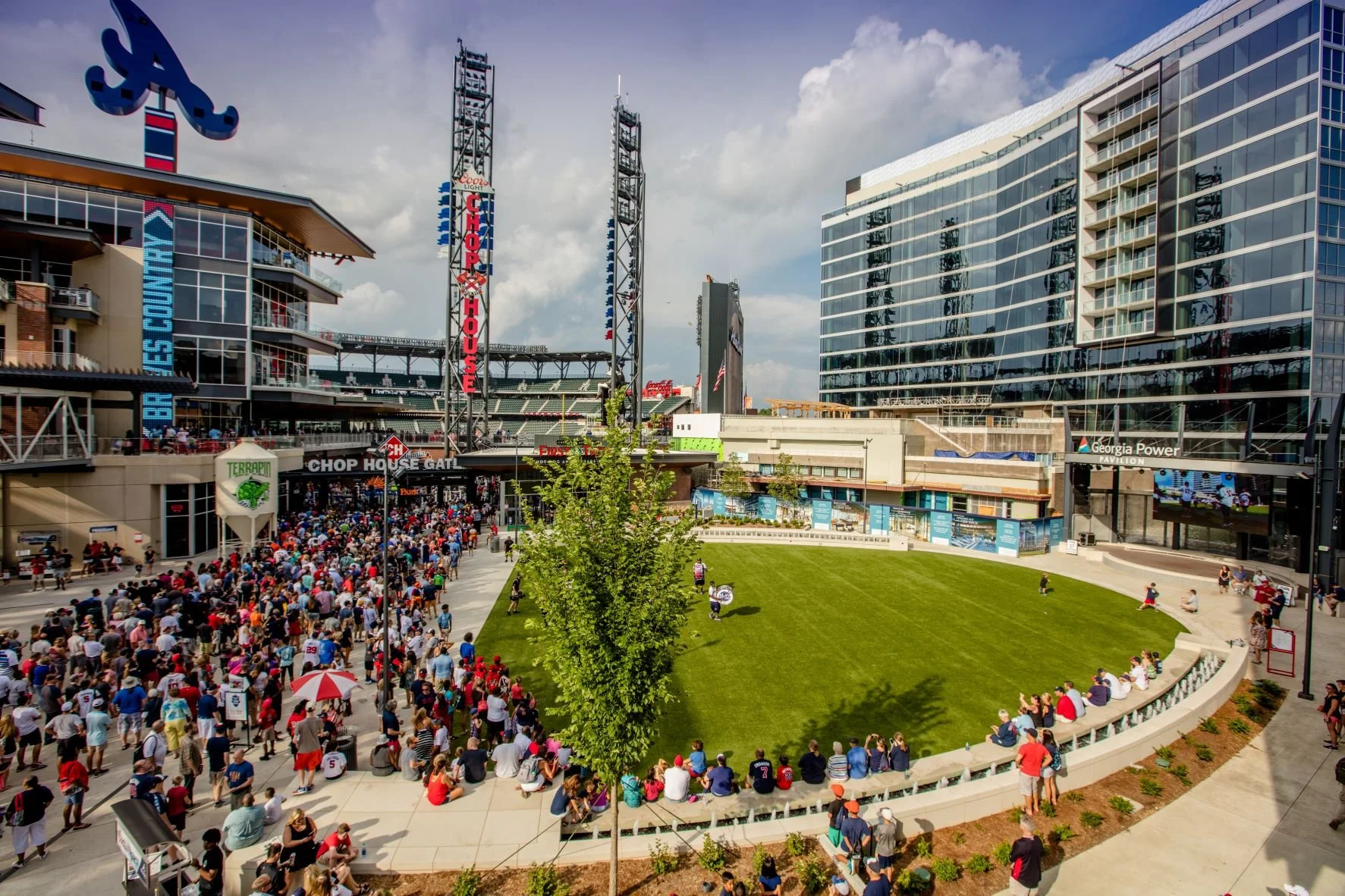   The Battery Atlanta at Truist Park ,   Atlanta, GA   - The central plaza space offers an abundance of seating options from terraced seating to benches to comfortable turf.  