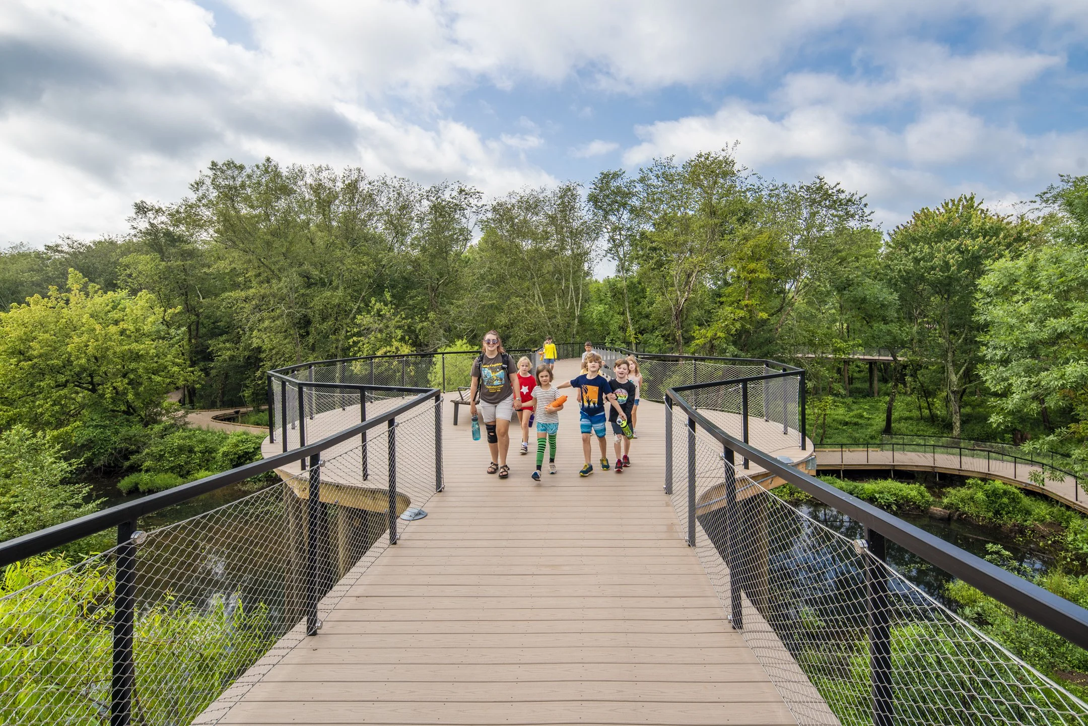 Chattahoochee Nature Center, Roswell, Georgia. ADA-compliant boardwalk and pedestrian-bridge allow a focused experience to the river without vehicle interference.