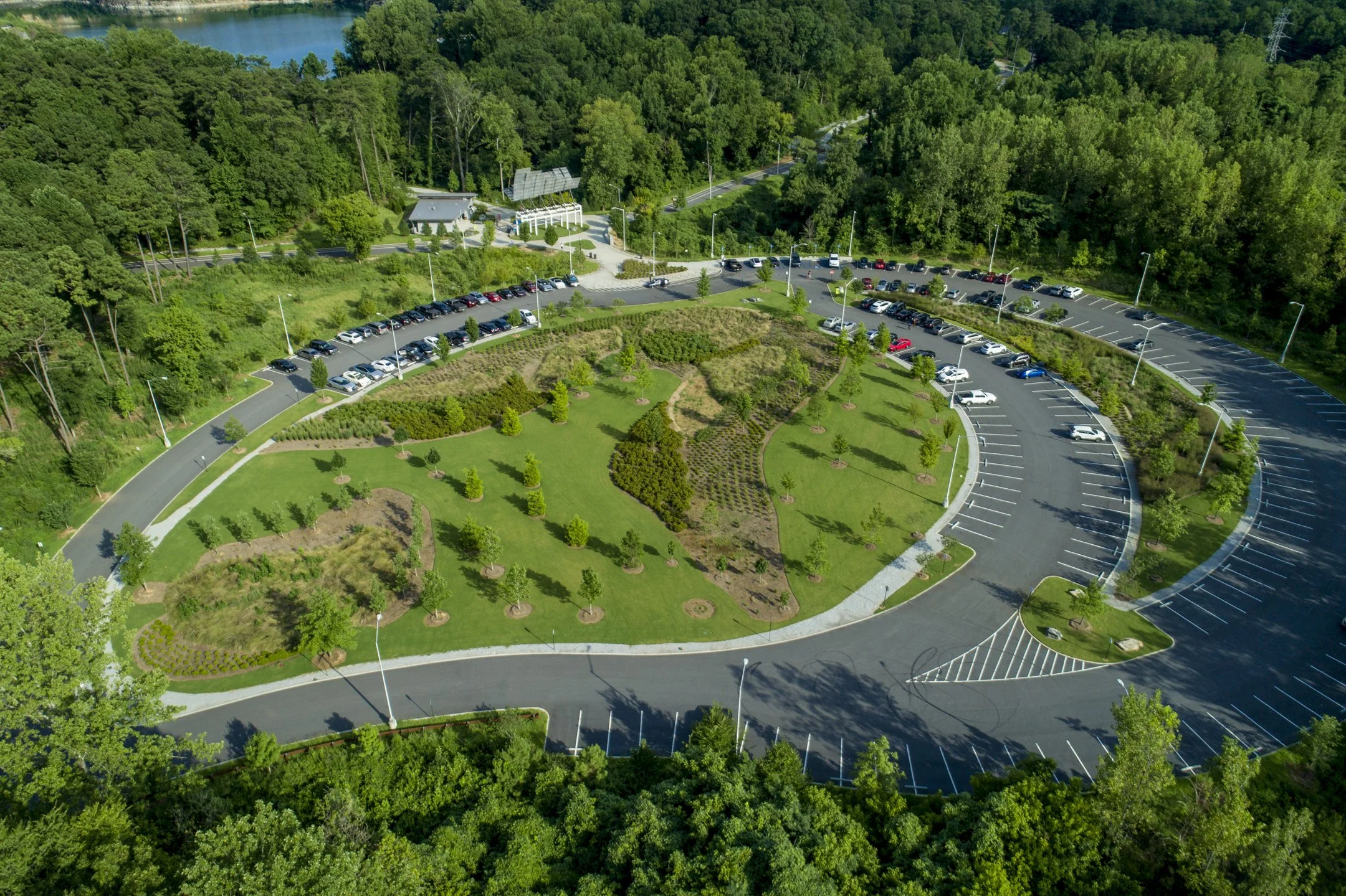 Westside Park, Atlanta, Georgia. A 2.1-acre teardrop parking lot with vegetated swales, bio-detention cells, native plantings and EV charging stations.