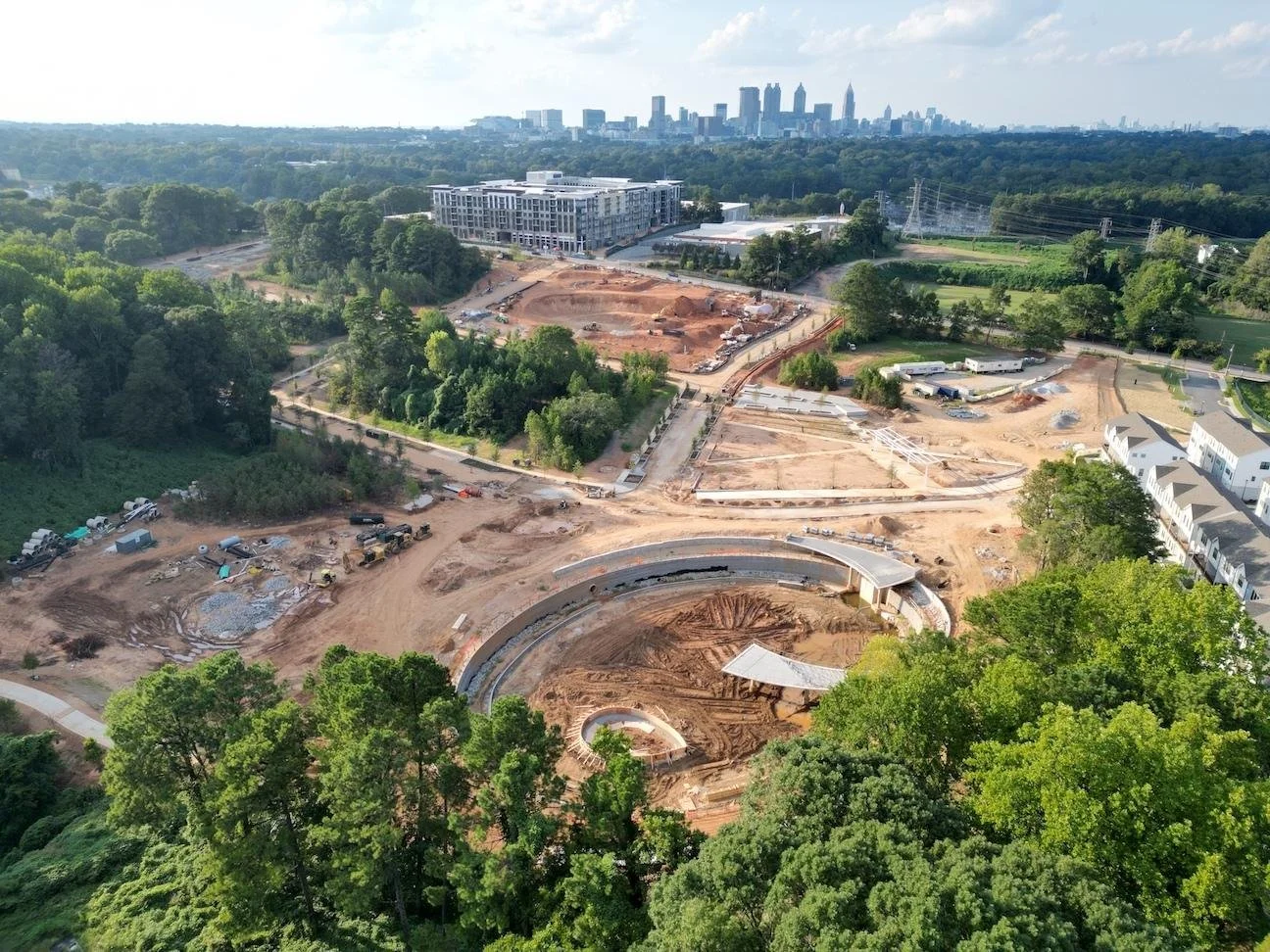  Construction progress at the Englewood greenspace project shown in recent weeks south of downtown, with the new Upton apartments in the middle distance. 
