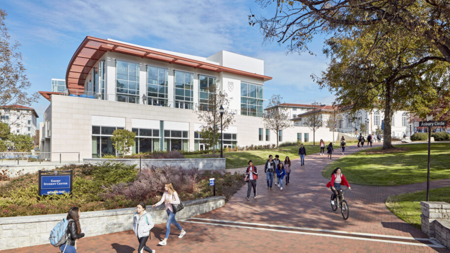 students walking on brick walkway outside Campus Life Center at Emory University