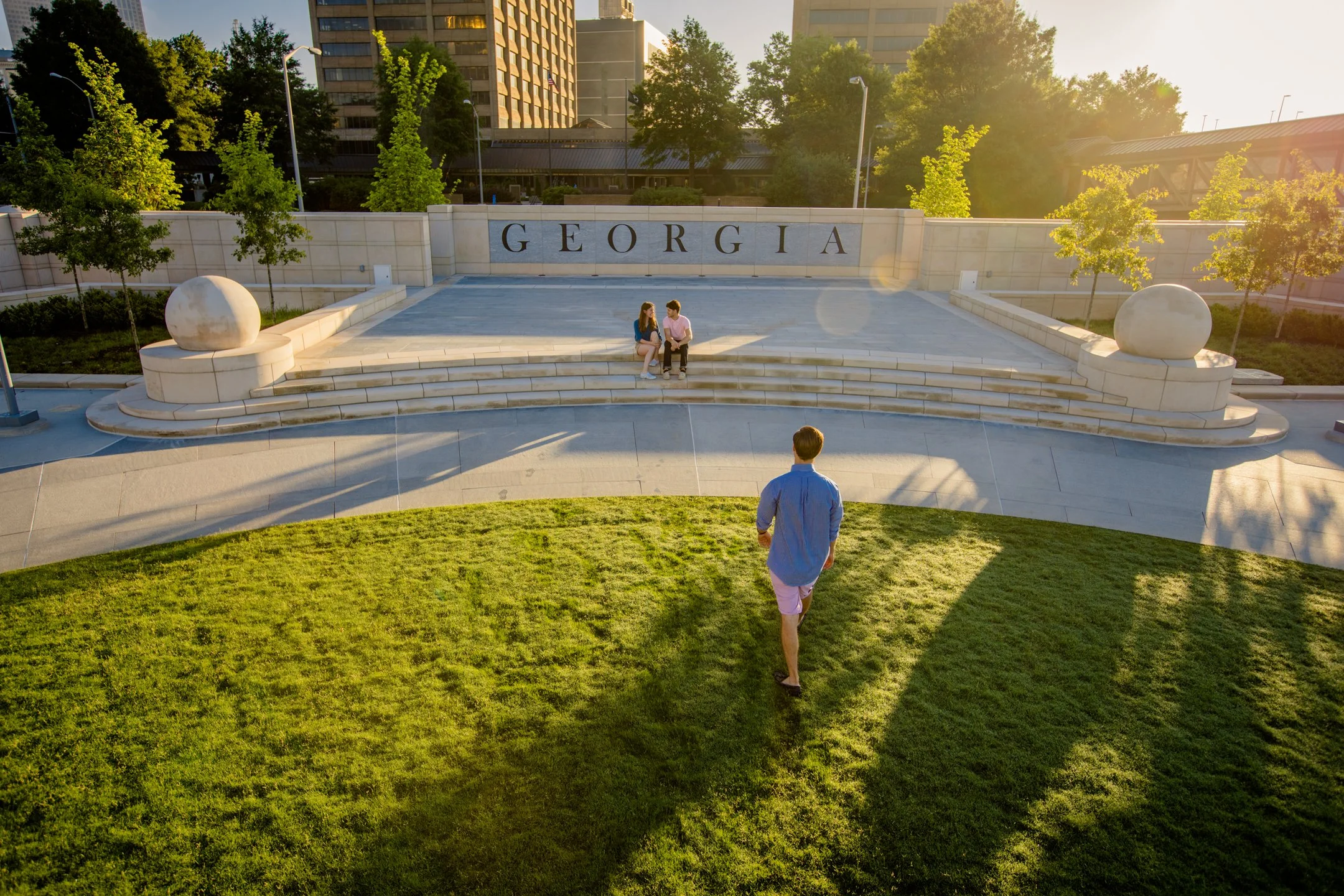  Flanking the stage are Georgia Oaks and Southern Live Oaks border the edge of the Plaza, creating a picturesque view of the State Capitol 
