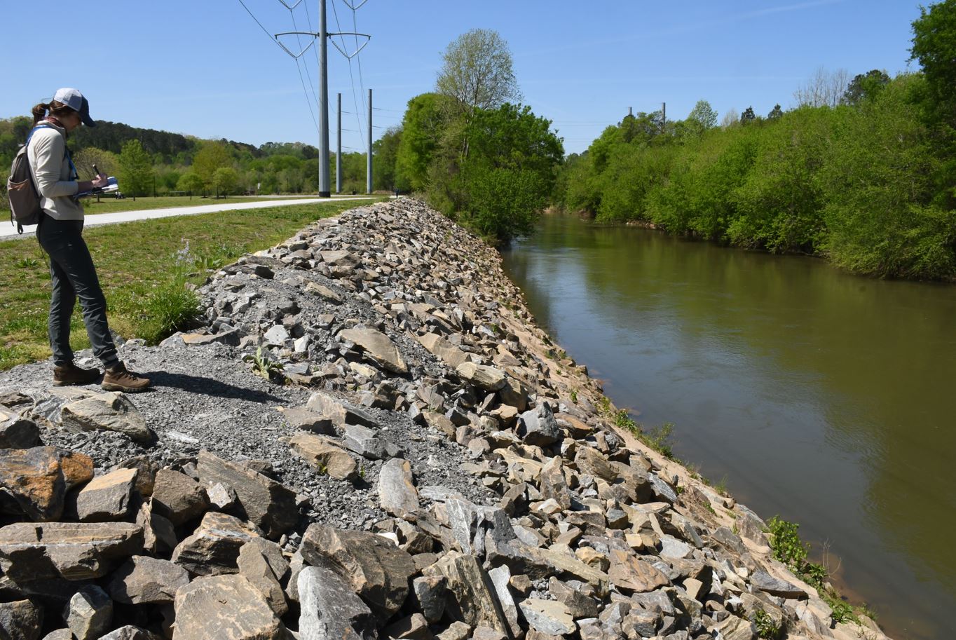 person in front of rocky embankment