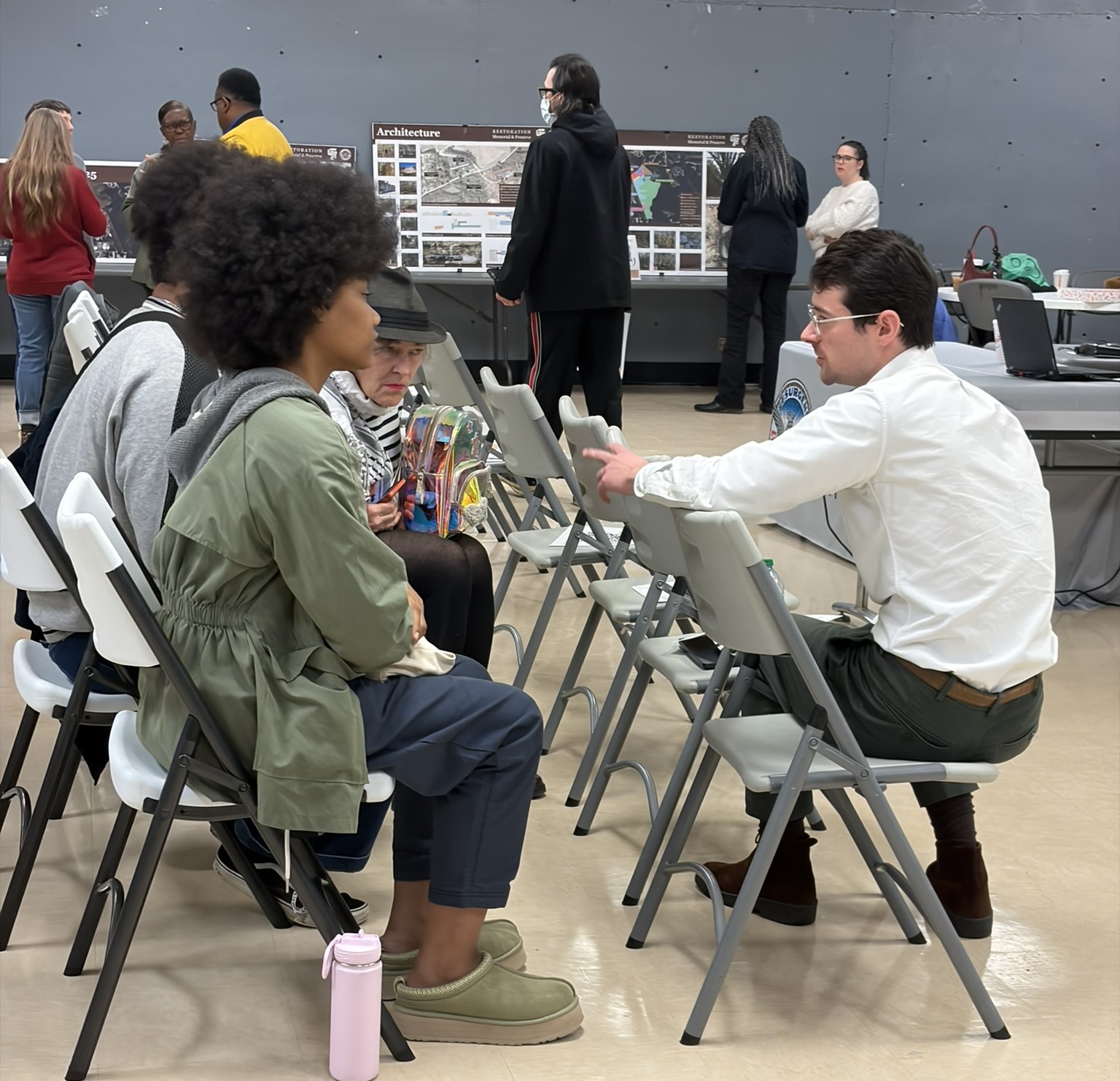 people seated talking at career event