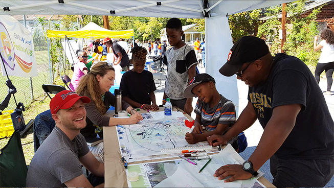 people working at a booth