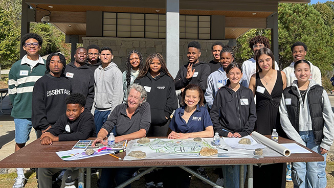 Group of students around table
